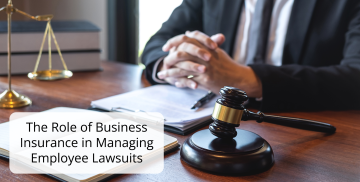 A man in a suit is sitting at a desk with a gavel and scales of justice.