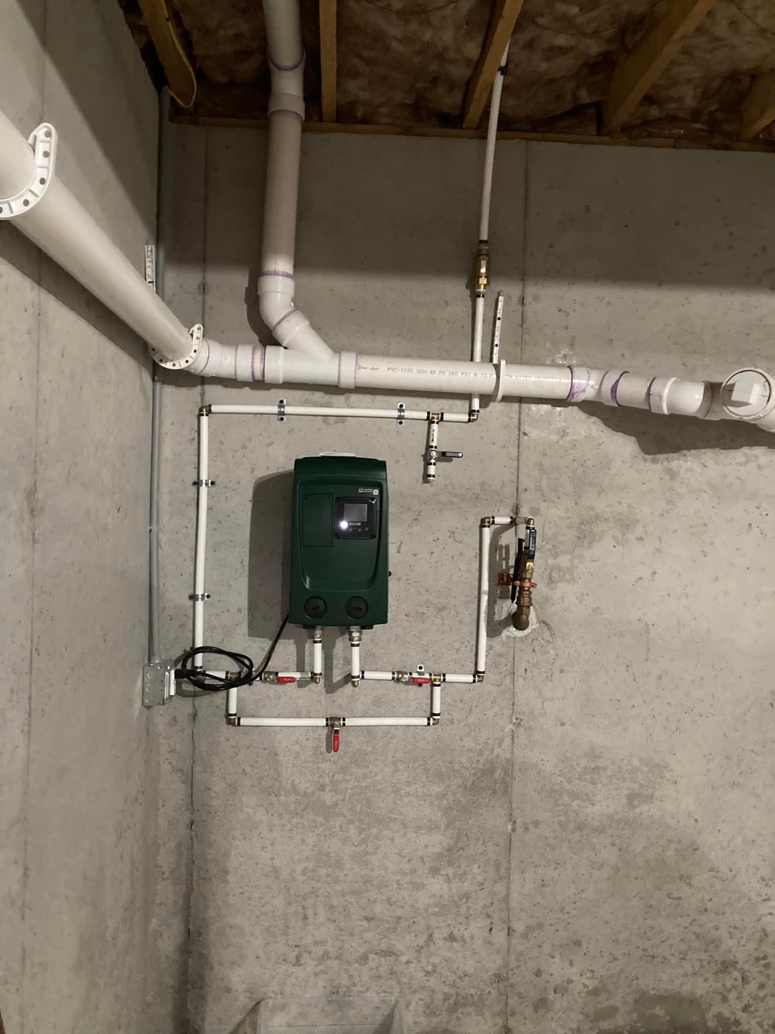 A person is working on a swimming pool pump.