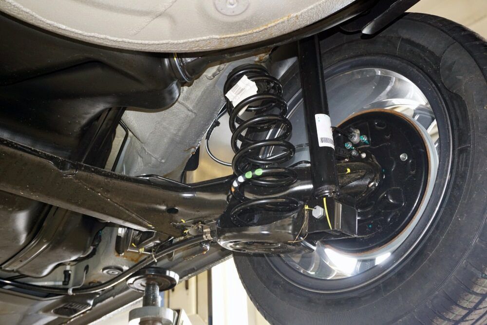 Underside of a Car's Rear Suspension With a Shock Absorber and Coil Spring — Nova Auto Innovations in Charlestown, NSW