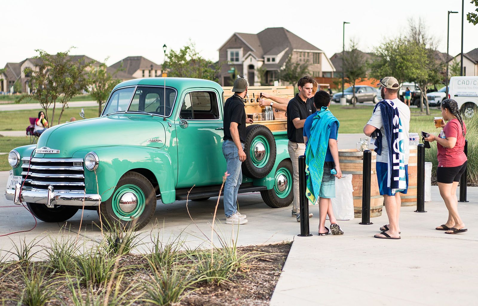 People Getting Beer From Vintage Truck | Morningstar Homes