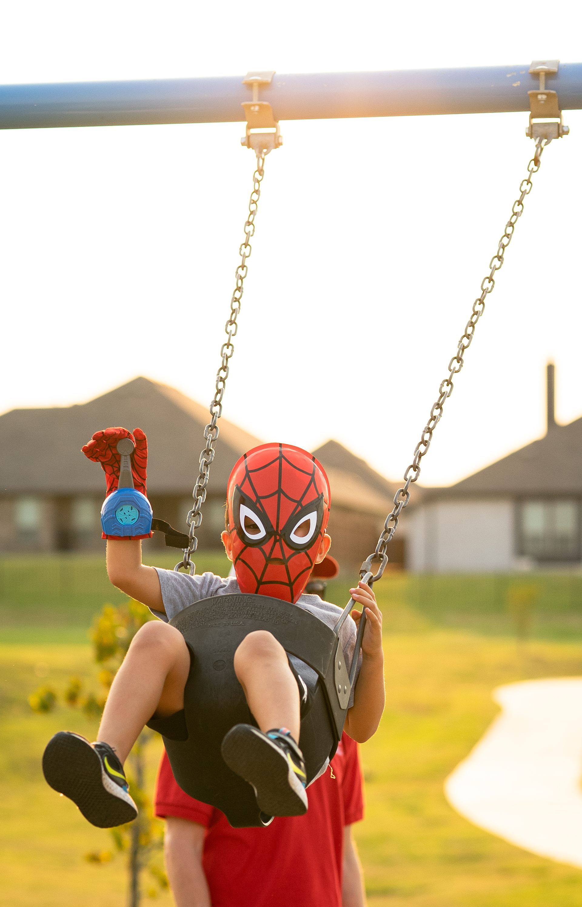 Child Dressed Up On Swing | Morningstar Homes