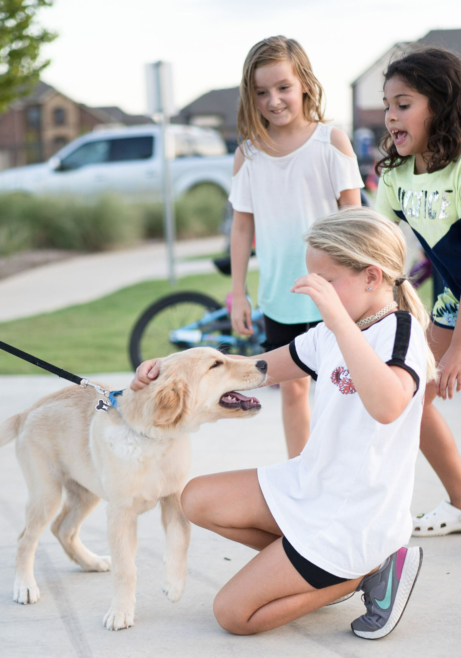Children Petting Dog | Morningstar Homes