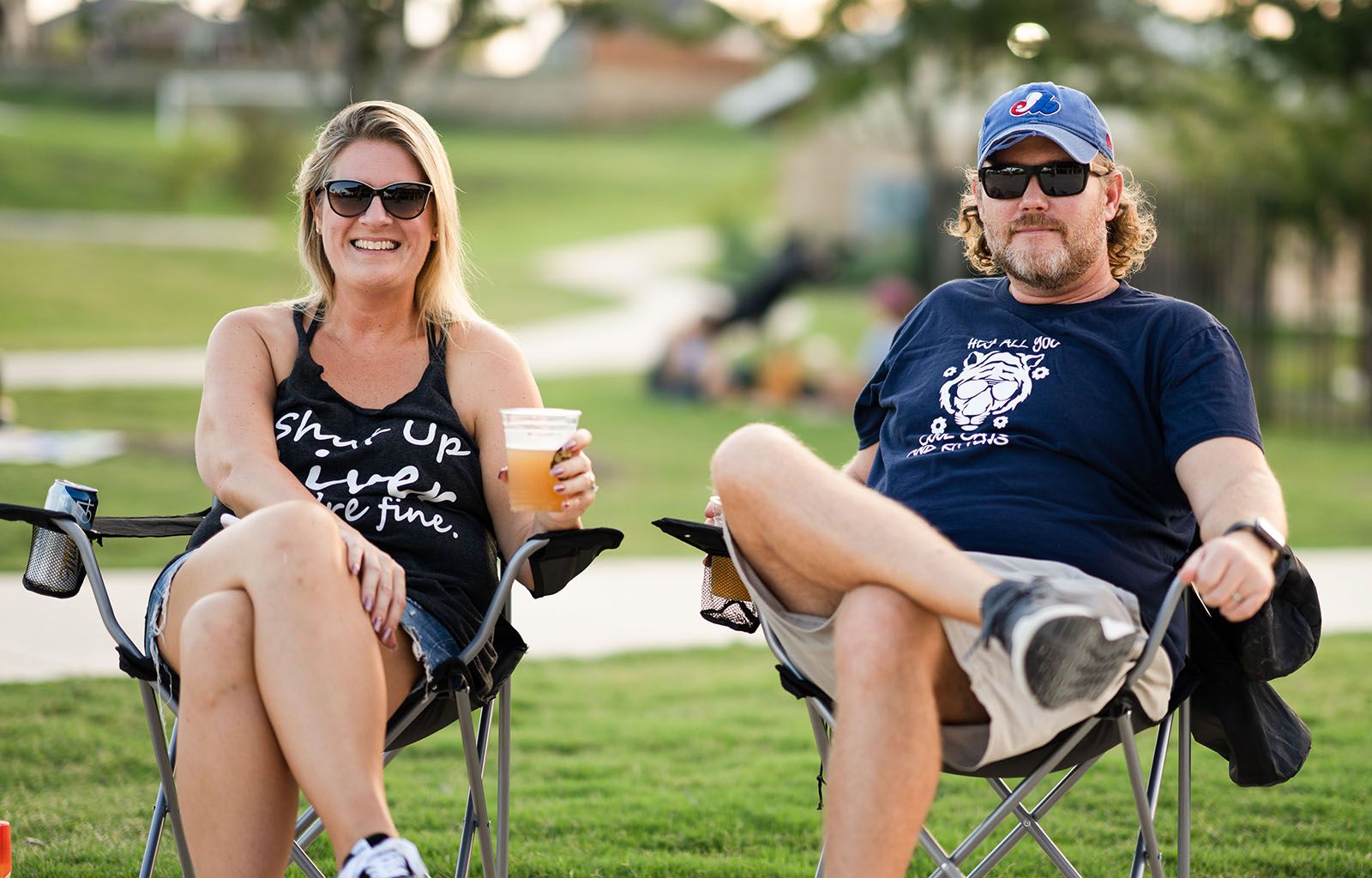 Couple Drinking Beer and Smiling at Outdoor Event | Morningstar Homes