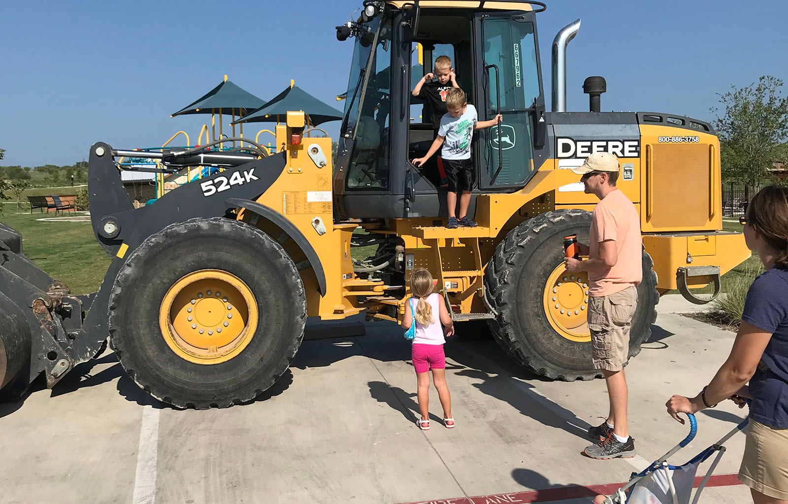 Kids Climbing Onto Tractor | Morningstar Homes