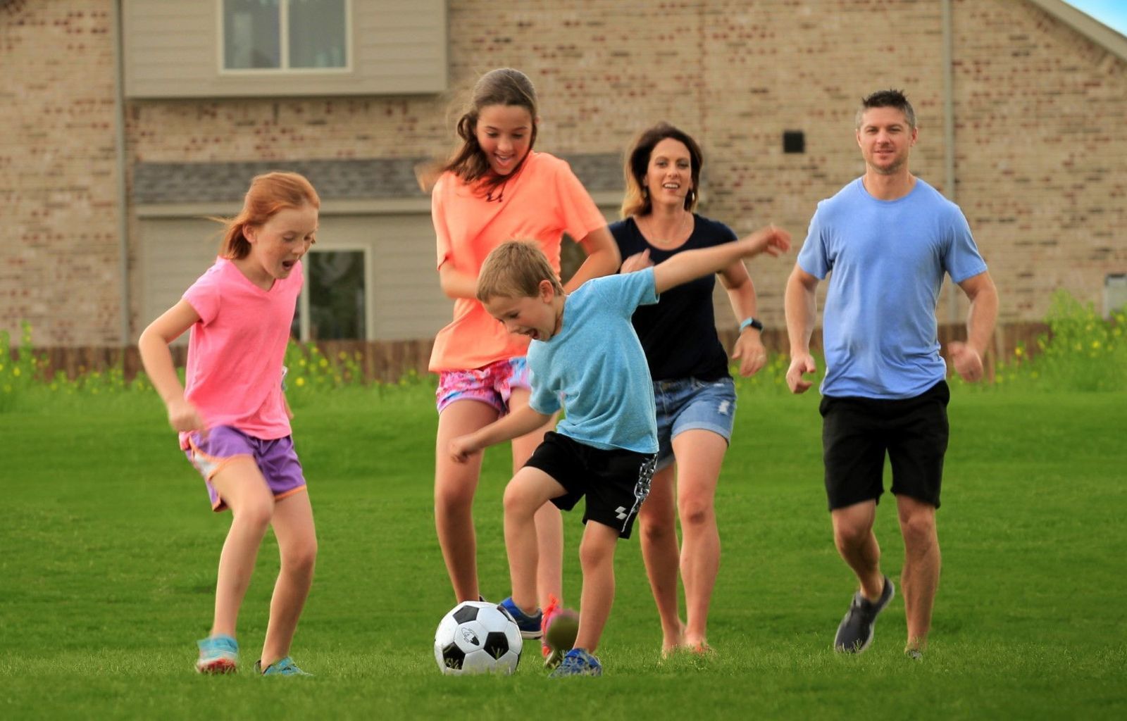 Family Playing Soccer | Morningstar Homes