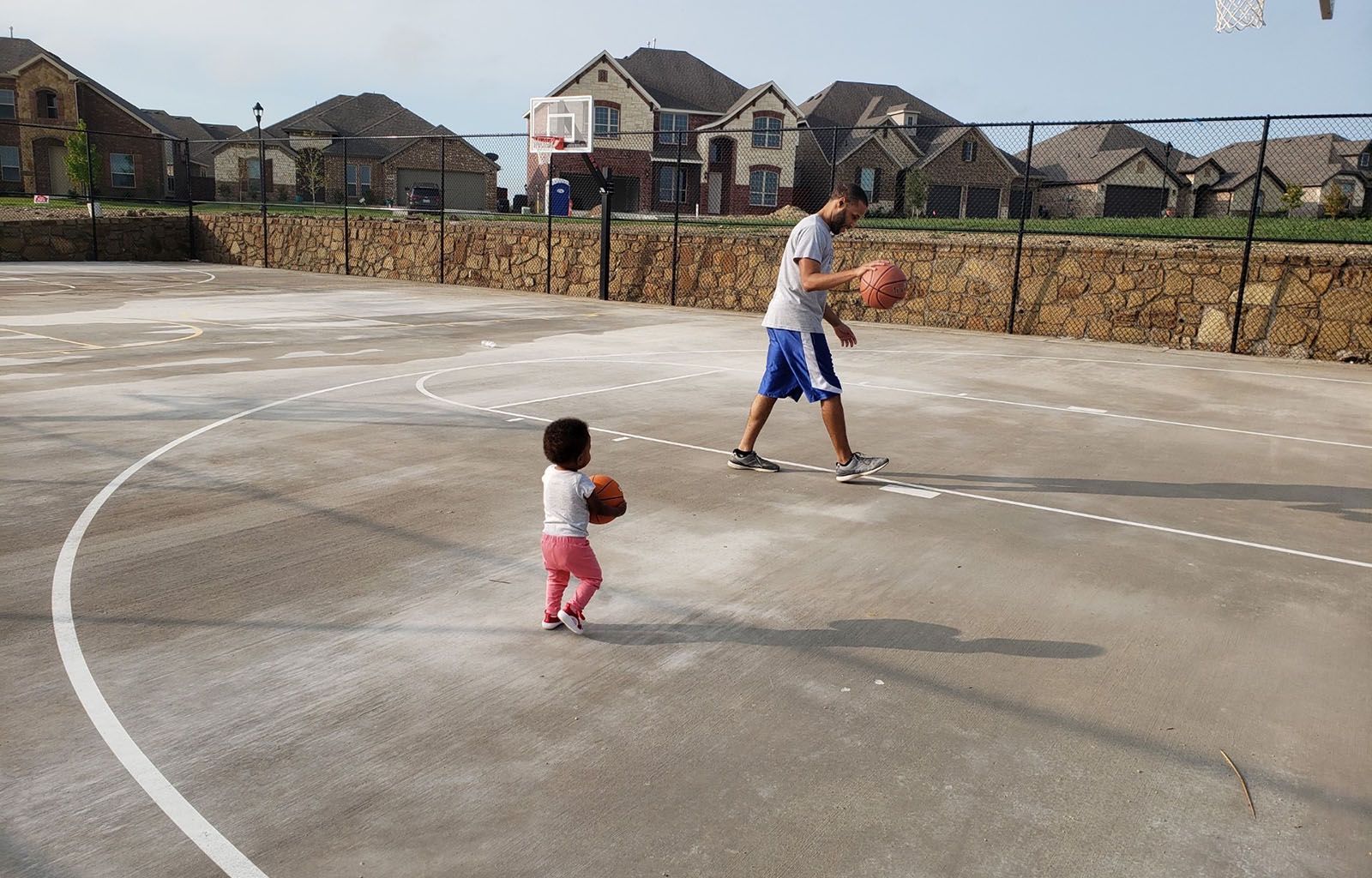 Child and Parent at Basketball Court | Morningstar Homes