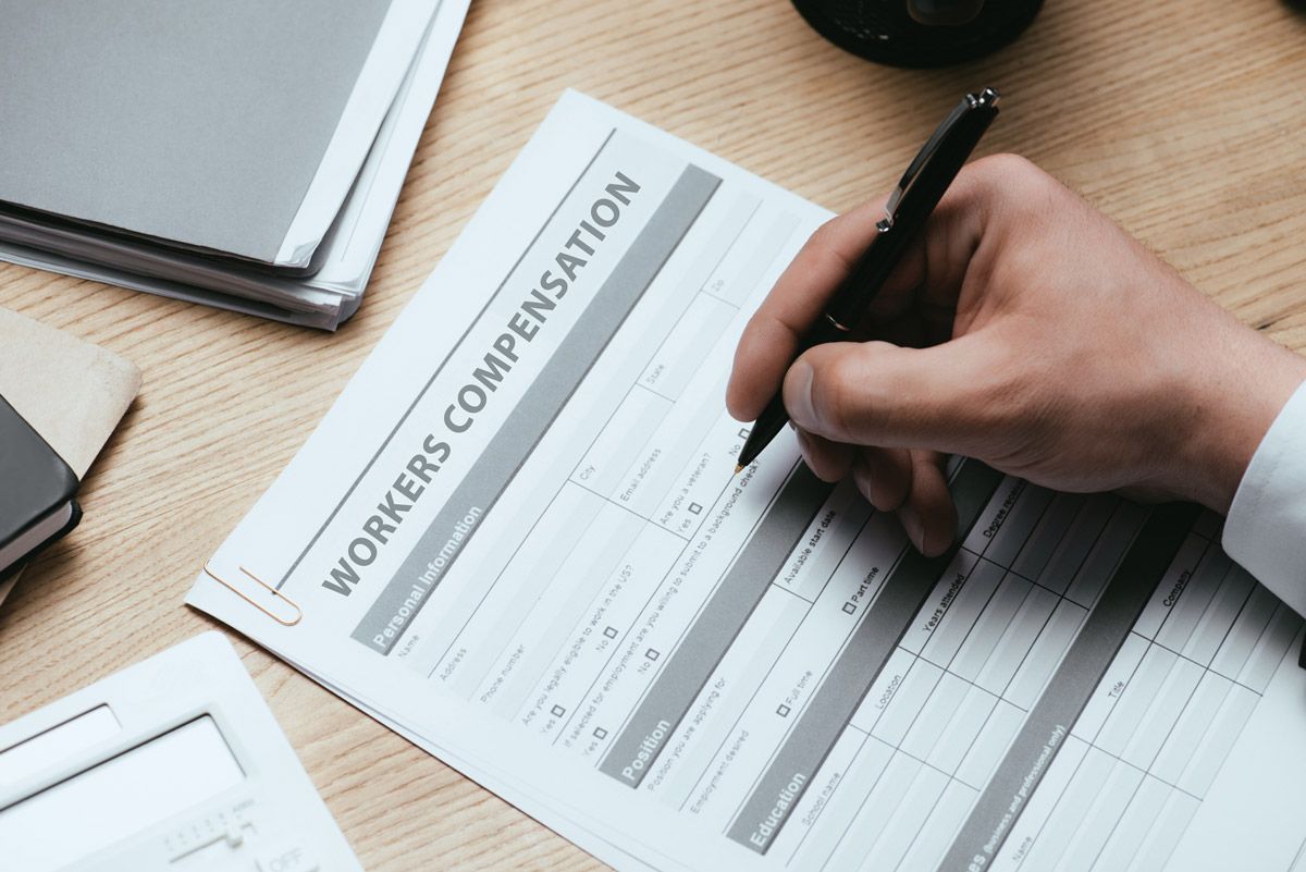 Man Filling in Workers Compensation Form — Tacoma, WA — Vail, Cross-Euteneier & Associates