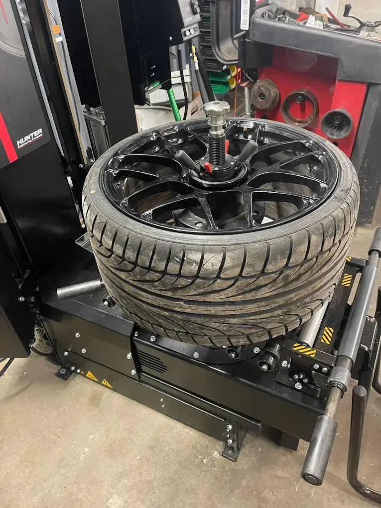 Tire Being Fixed | Cutting Edge Automotive LLC