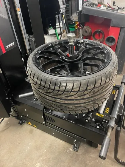 Tire Being Fixed | Cutting Edge Automotive LLC