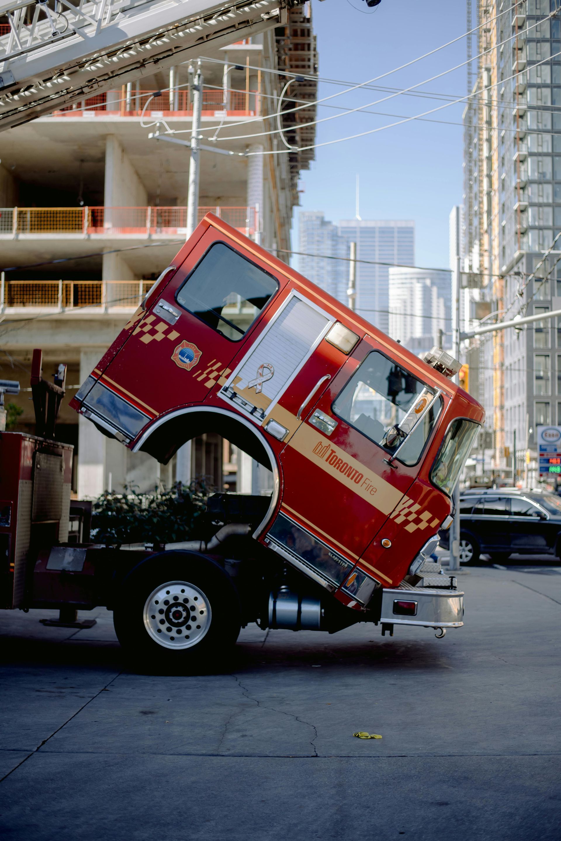 A red fire truck is parked on the side of the road