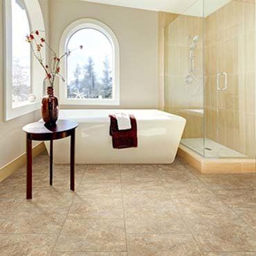 Bathtub And A Wooden Table With Vase — Ypsilanti, MI — Carpet Center & Floors