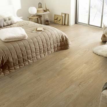Bedroom Interior with Laminate Flooring — Ypsilanti, MI — Carpet Center & Floors