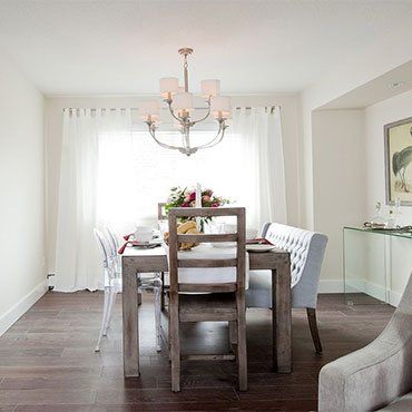 Flooring Installation — Wooden Table With Chandelier in Ypsilanti, MI