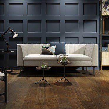 Long Couch With Throw Pillows  — Ypsilanti, MI — Carpet Center & Floors