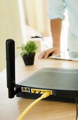 Internet cable and router at home — Cabling services in Manunda, QLD