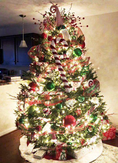 A christmas tree decorated with red and green ornaments and candy canes