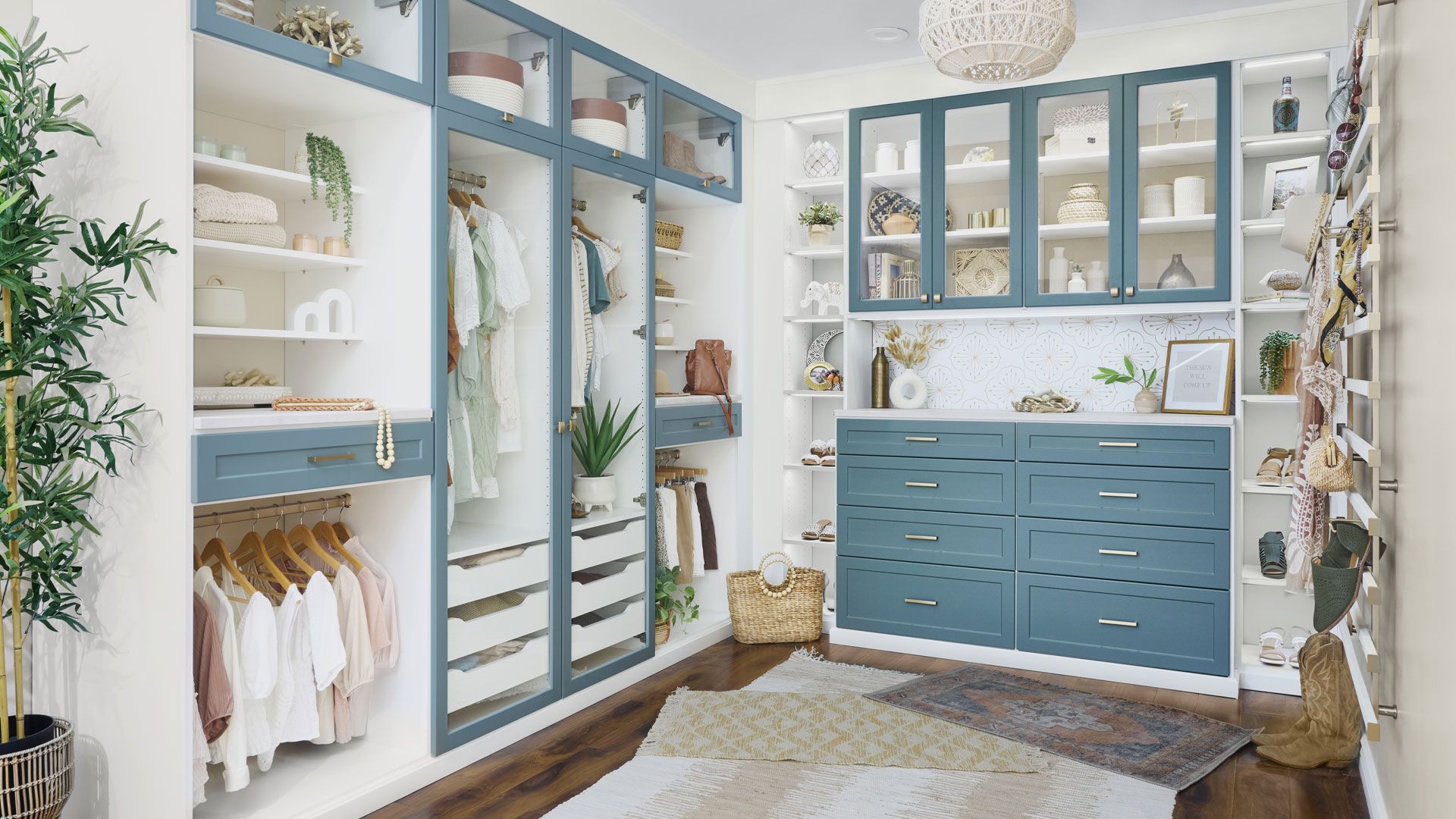 a walk in closet filled with lots of clothes and drawers .