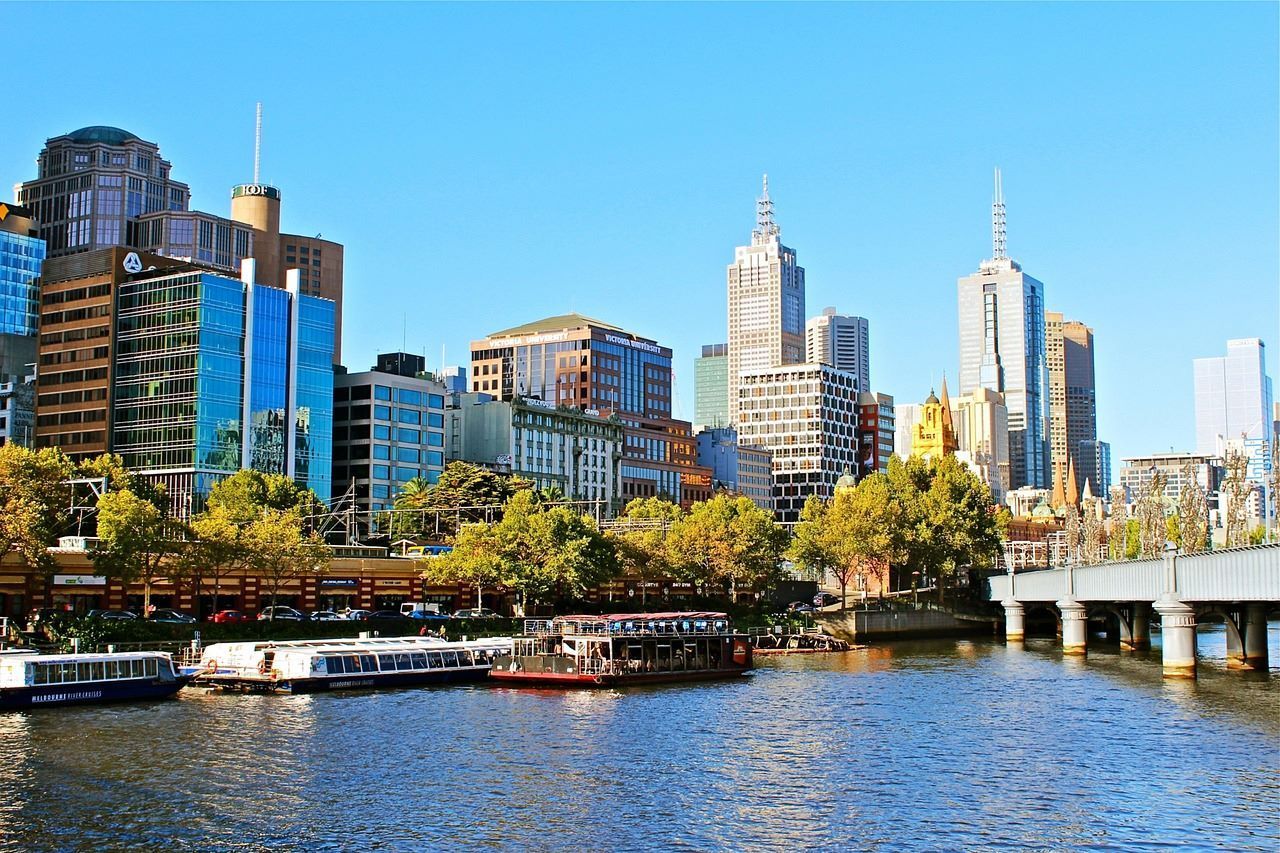 A scenic view of a river in Melbourne and surrounding urban landscape.