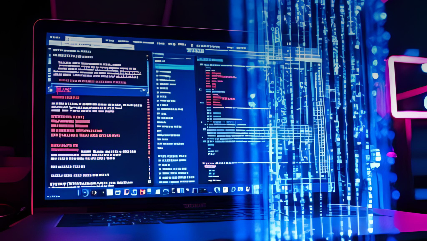 Laptop displaying code with streams of blue digital data overlayed.