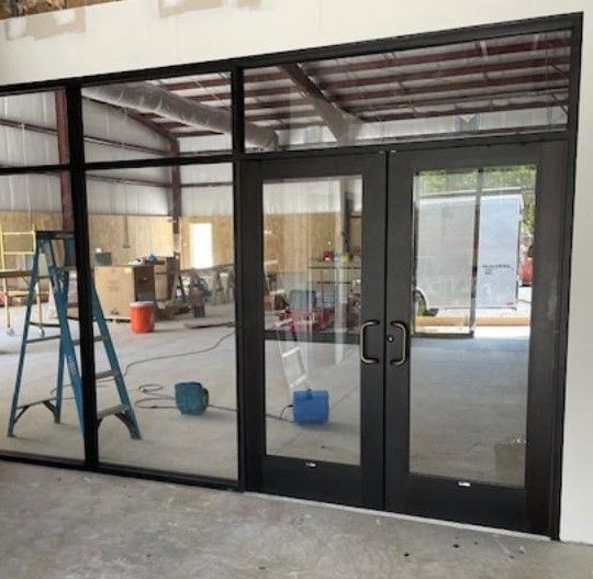 A building under construction with a ladder in the corner