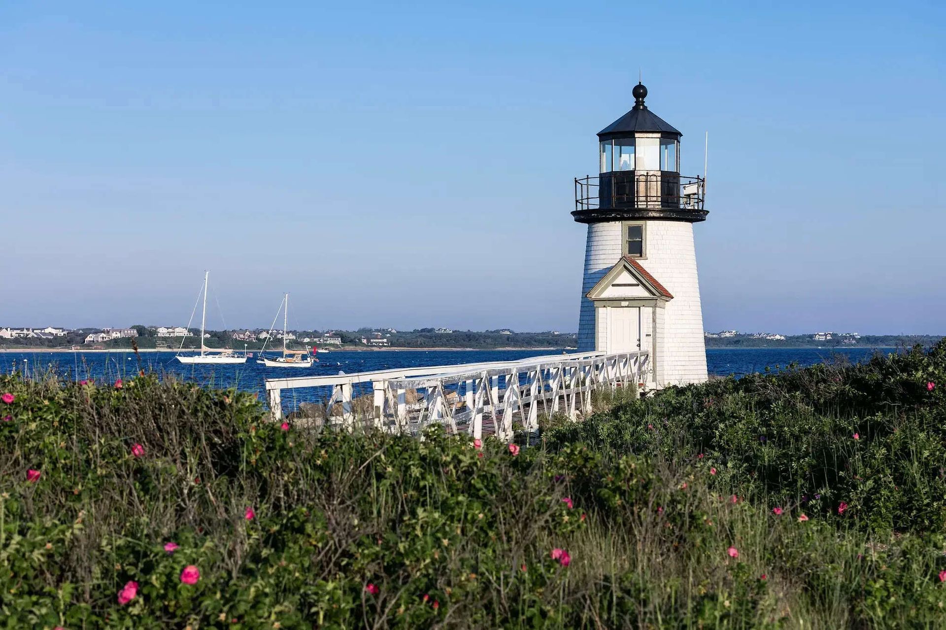 A man is sanding a boat with a sander.
