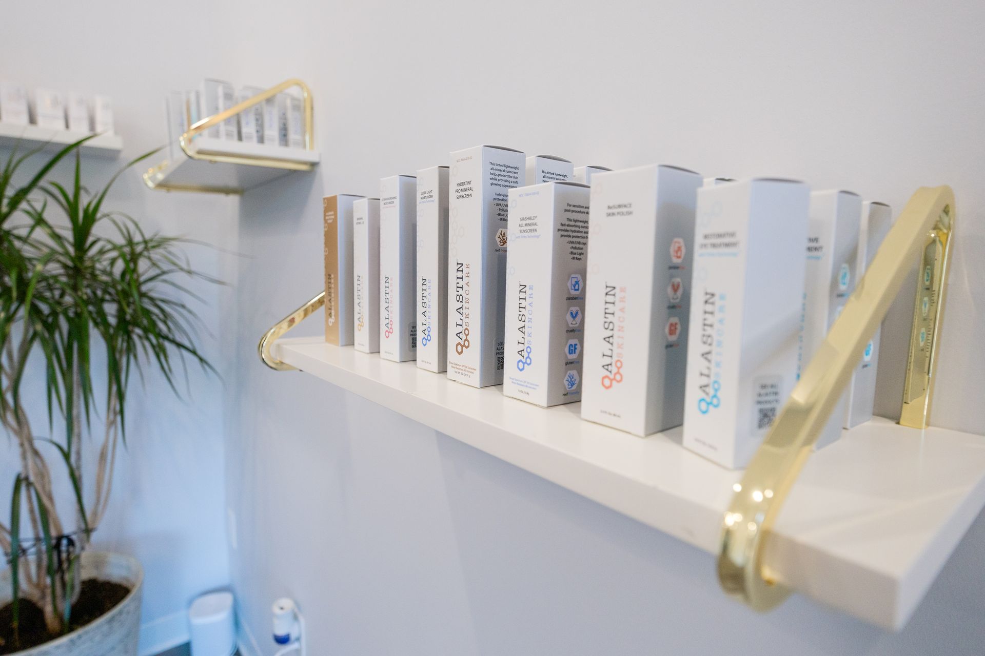 Skincare products on a shelf hanging on a wall