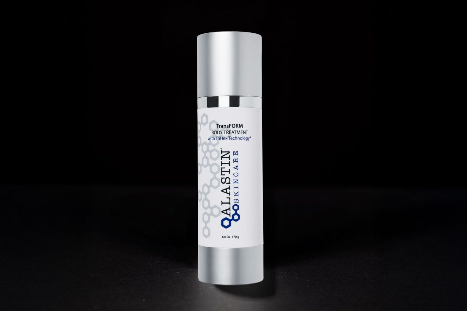 A cylindrical skincare product with a silver top and bottom, white body, and blue and white text against a black background.