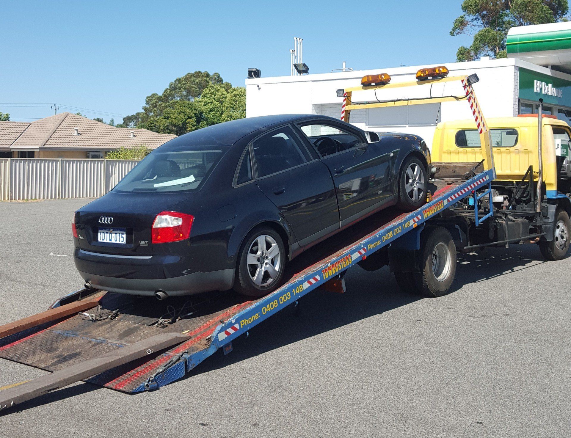 Car being towed away in a tow truck