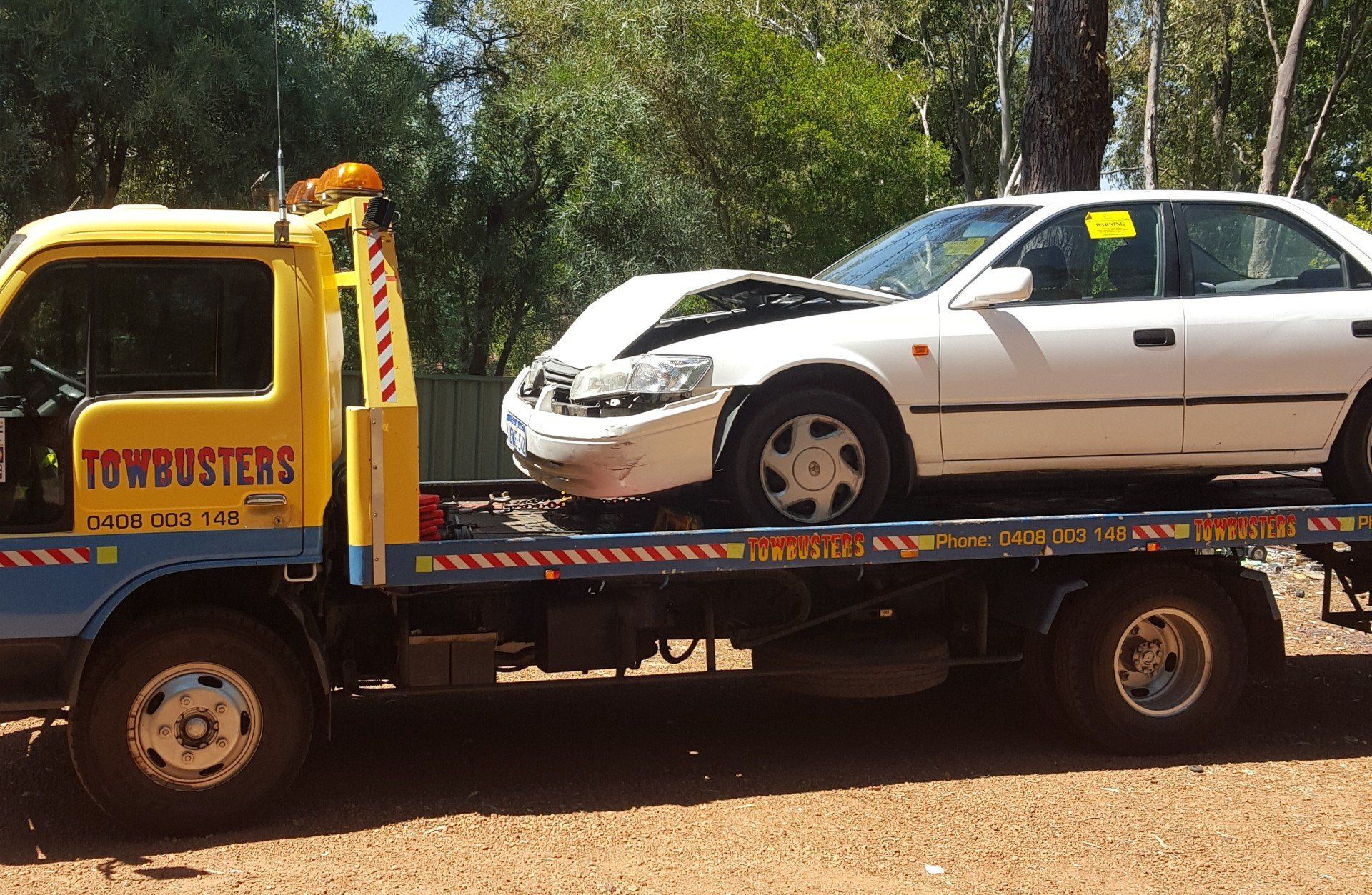Automobile being towed away