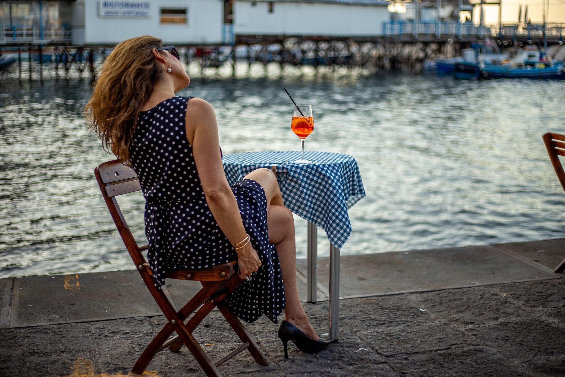 Woman relaxing by the seaside in Sorrento – Elegant Travel Photography.