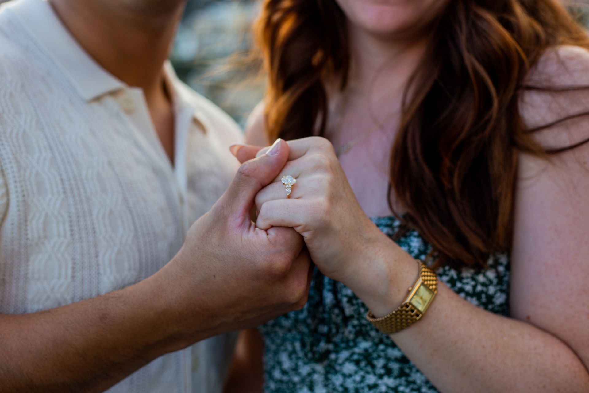 Couple holding hands and smiling – Engagement Photography.