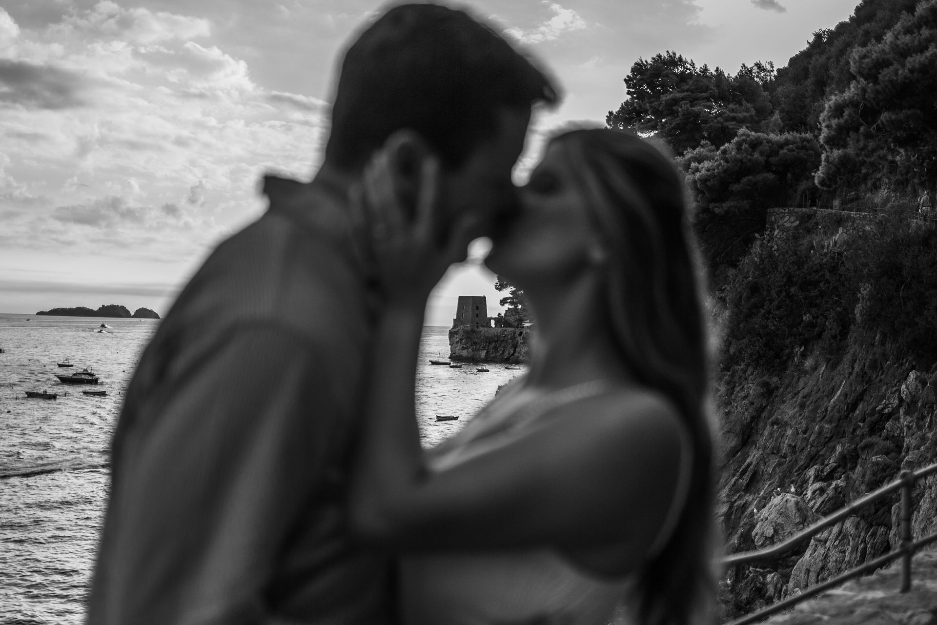 Couple kissing at sunset on the beach of Positano – Romantic Photo.