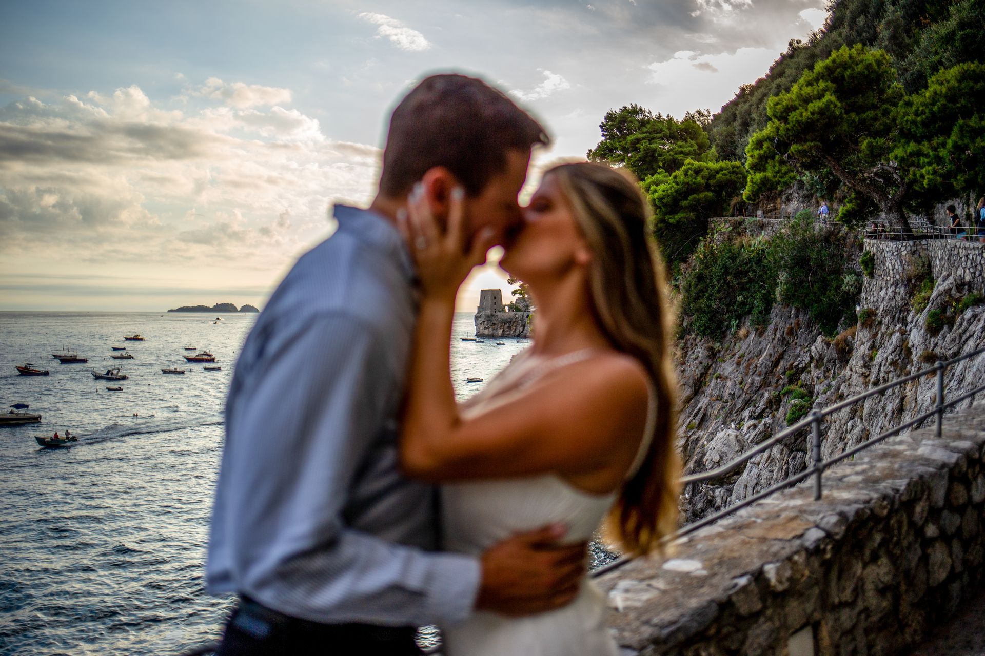 Couple kissing by the sea on the Amalfi Coast – Romantic Photo.