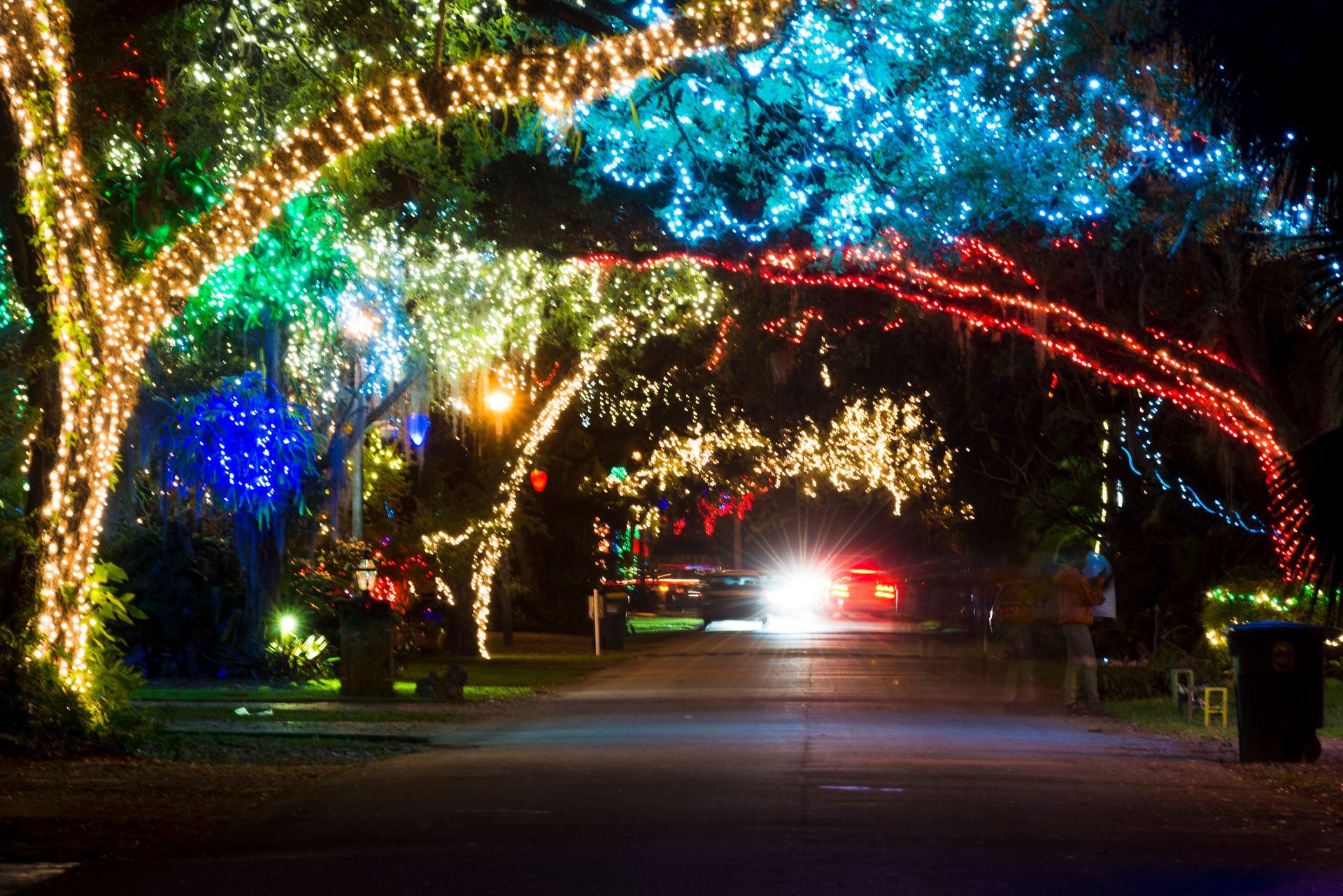 Electrician inspecting holiday lighting and outlets in a Miami home for winter electrical safety.