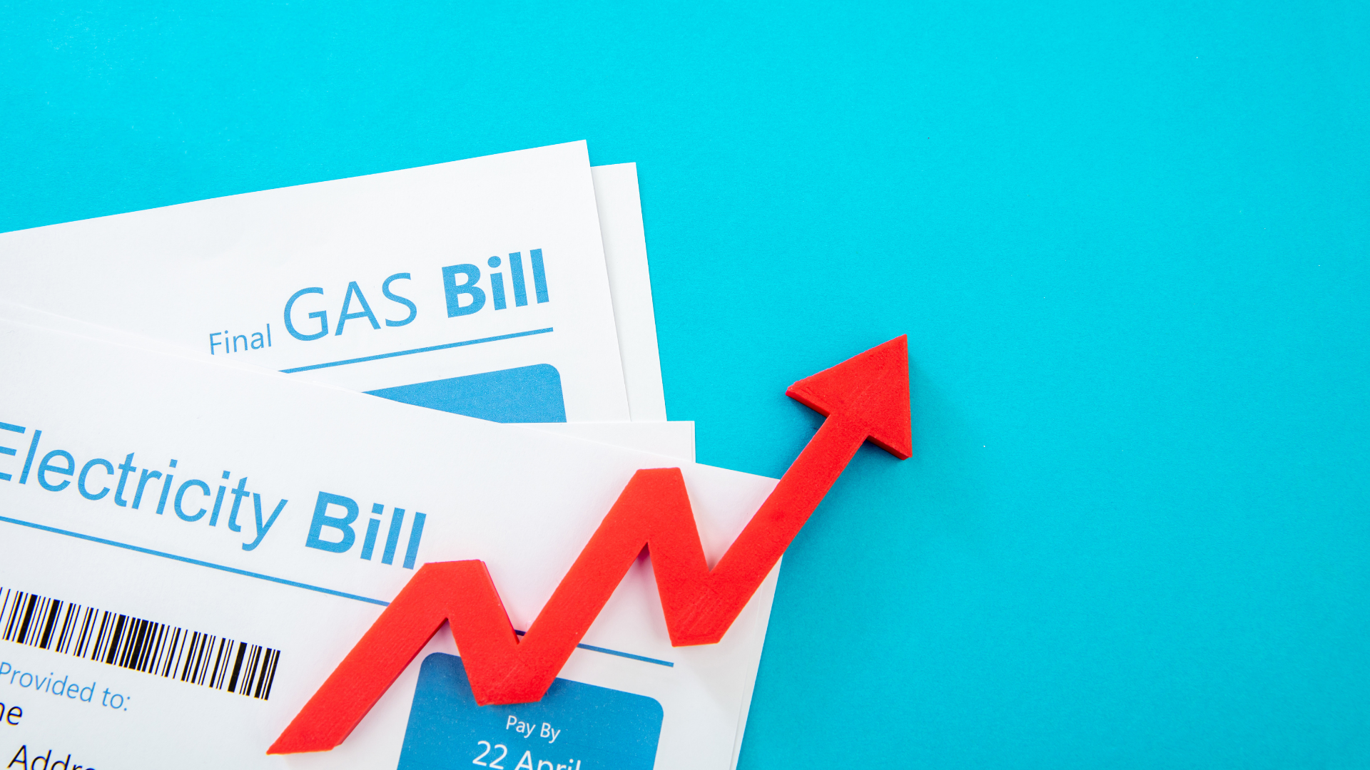 Gas and electricity bills with a red upward-pointing arrow, indicating rising costs, on a blue background.