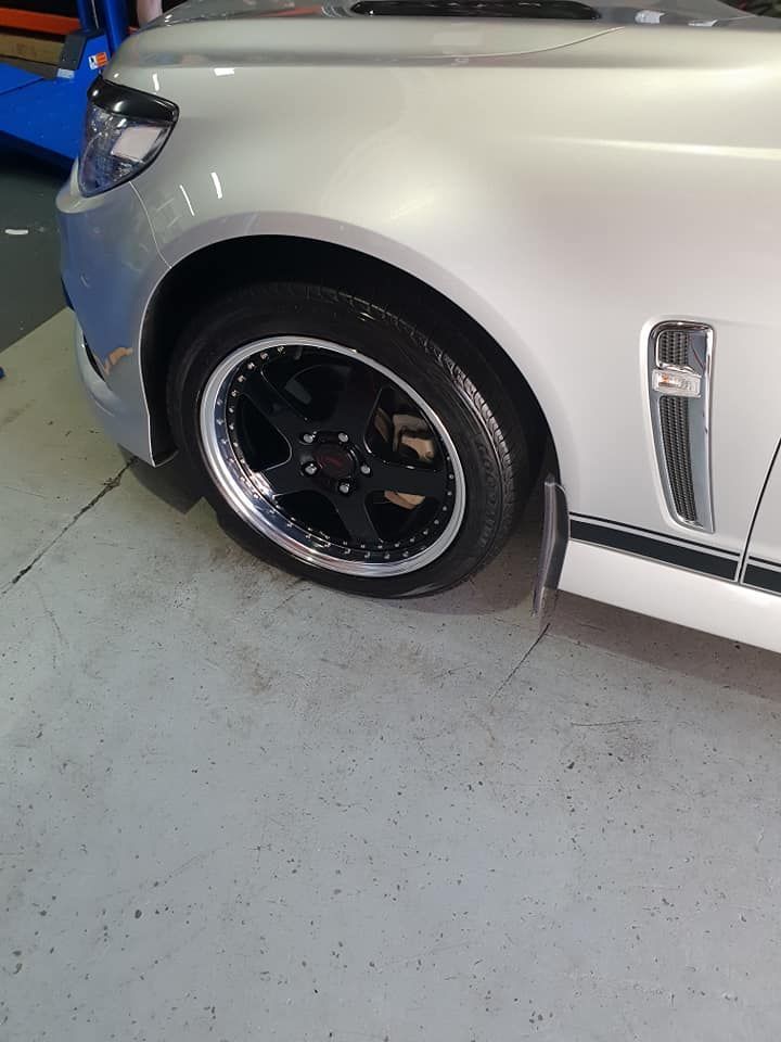 A Close Up Of A New Wheel Installed On A Silver Car — Budget Tyre Shed In Charmhaven, NSW