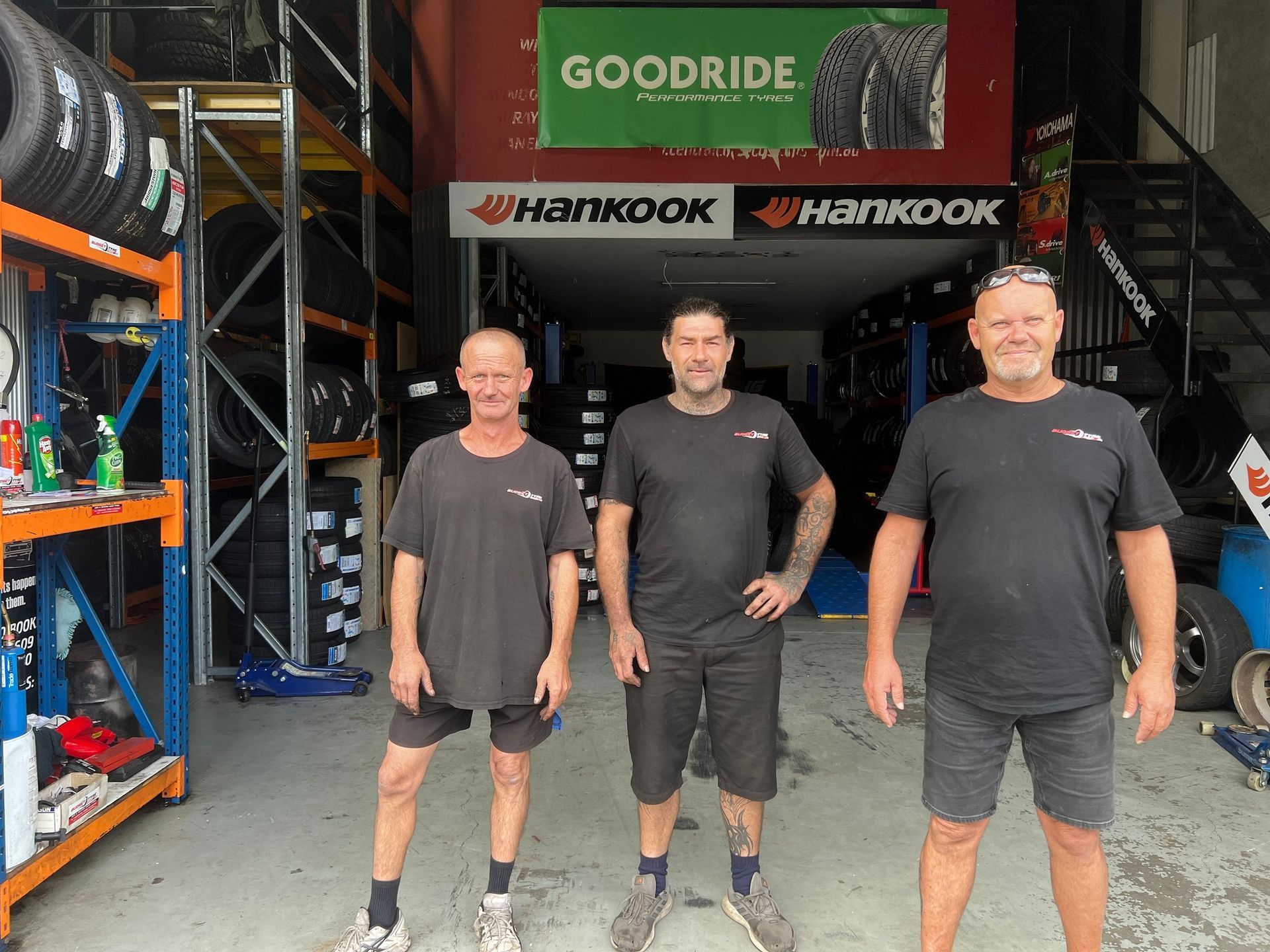 A person is spraying a tyre with a spray bottle — Budget Tyre Shed In Charmhaven, NSW