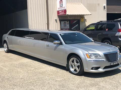 A limo driving out of a mechanic shop — Budget Tyre Shed In Charmhaven, NSW