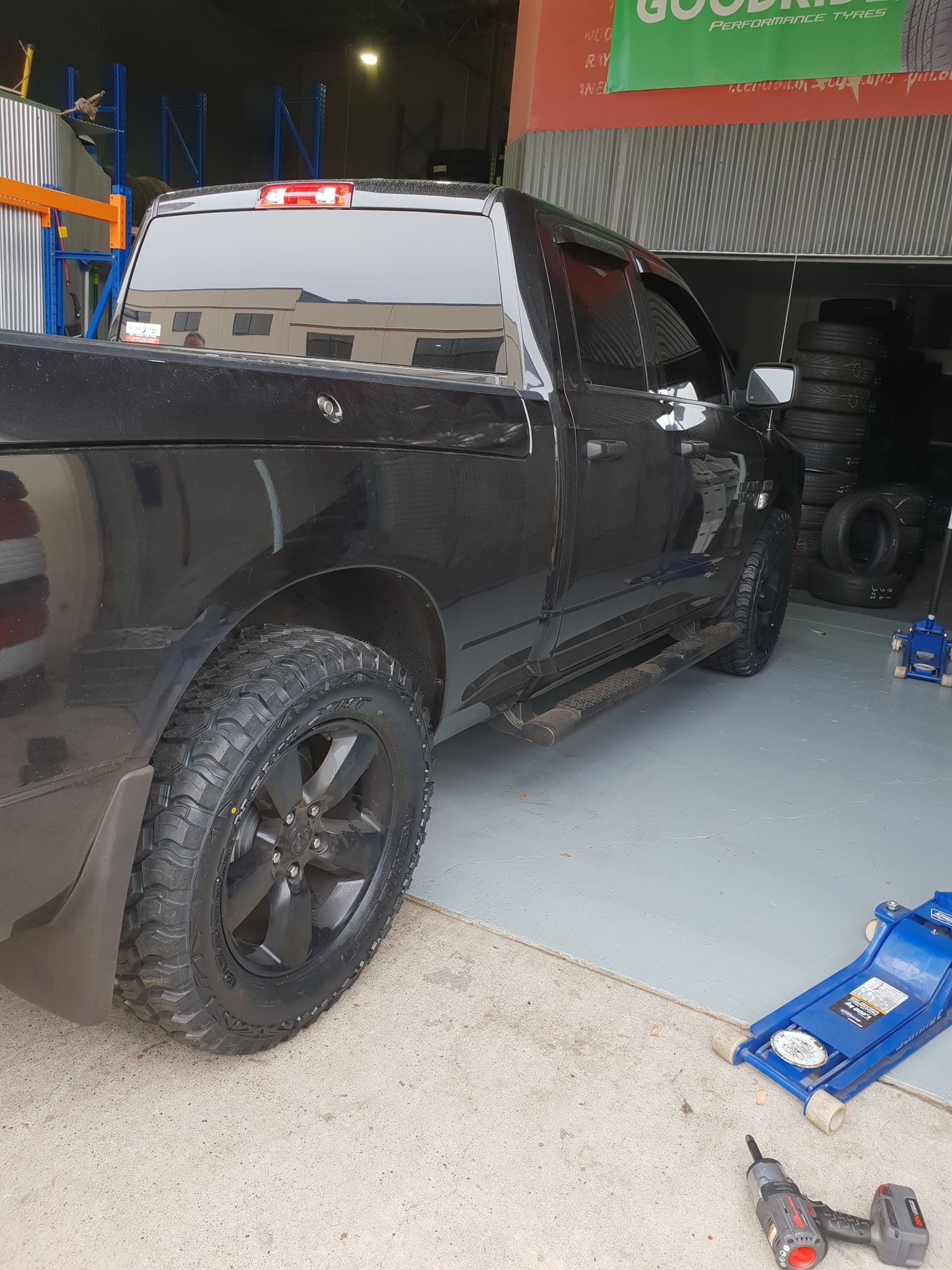 the back view of a truck parked inside a car shop — Budget Tyre Shed In Charmhaven, NSW
