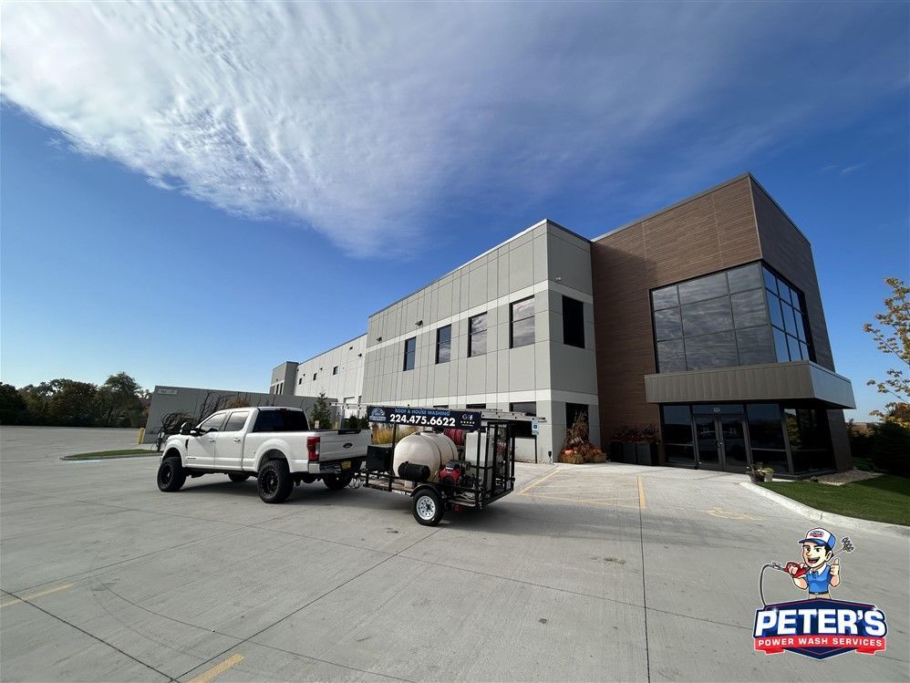 Image of a commercial parking lot and building cleaned by Peter's Power Wash Service