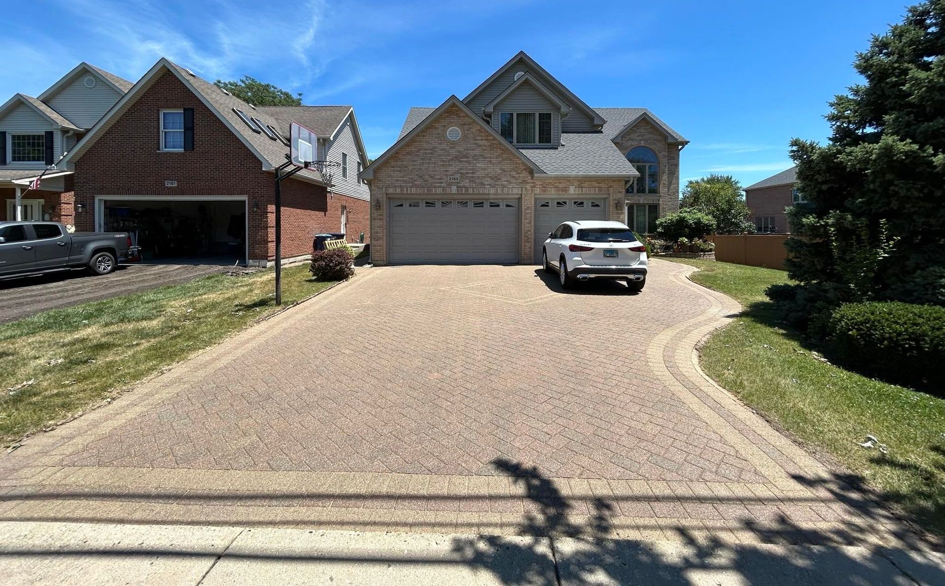 Picture of driveway that has been washed and sealed.