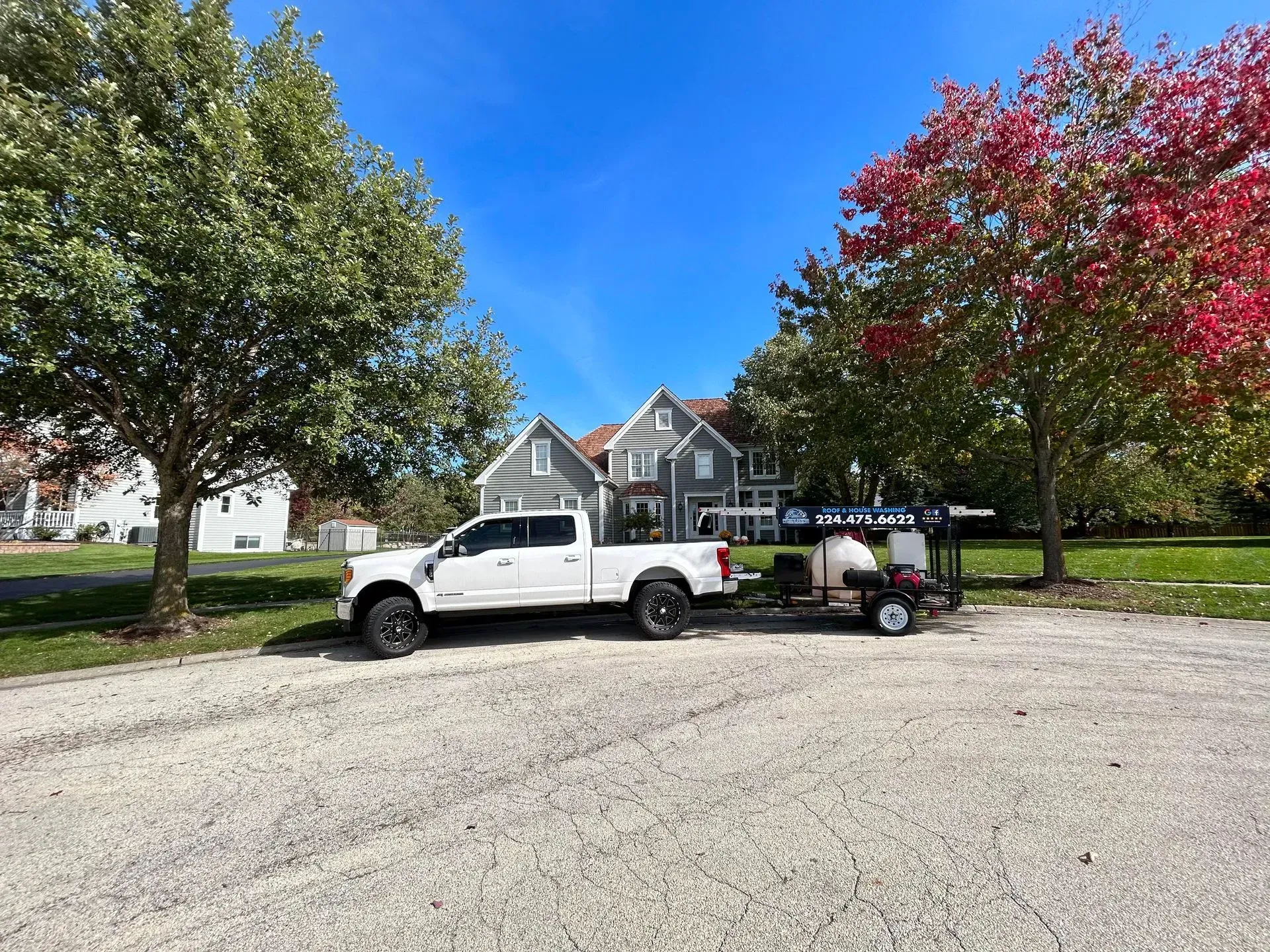 Image of Peter's Power Wash truck in a residential area in Northbrook, IL.