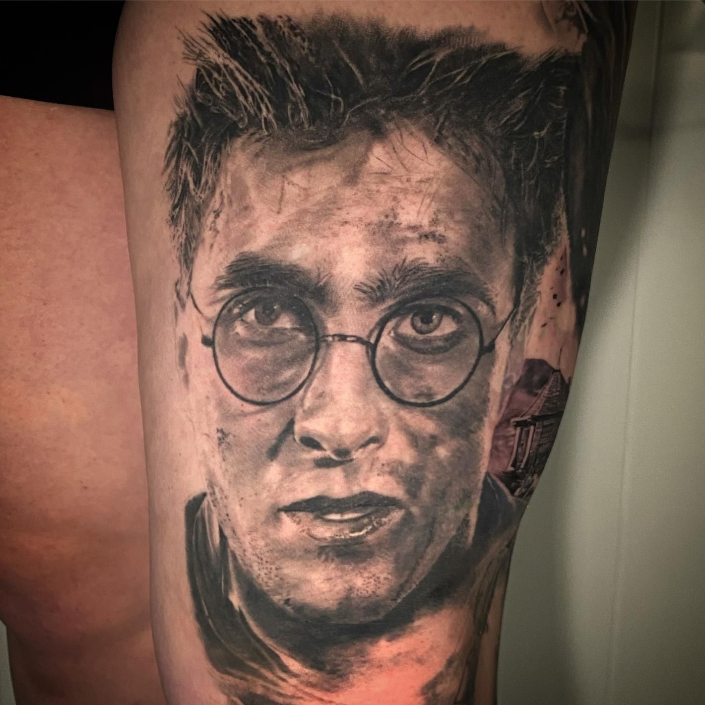 A Man Has a Tattoo Of A Man With Her Tongue Out And The Word Club On His Arm — Gallery Tattoo in Medowie, NSW