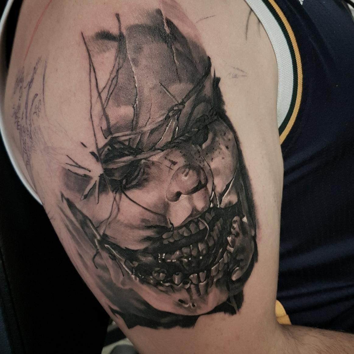 A Man Has a Tattoo of a Skull on His Arm — Gallery Tattoo in Maitland, NSW