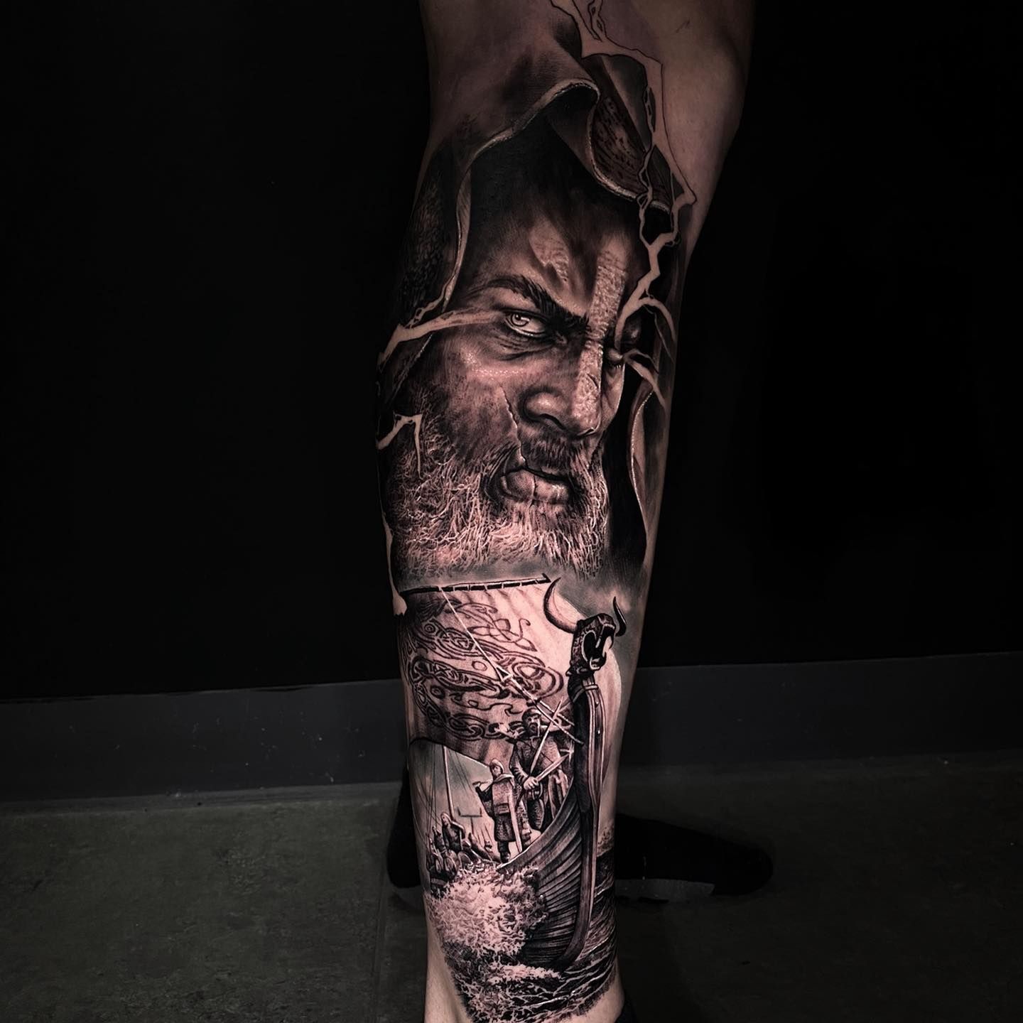 A black and white tattoo of a man with a beard on his leg  — Gallery Tattoo in Medowie, NSW