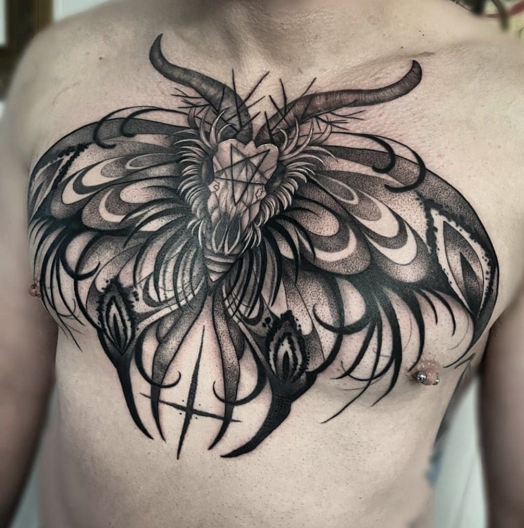 A Man Has a Tattoo of a Dragon on His Chest — Gallery Tattoo in Newcastle, NSW