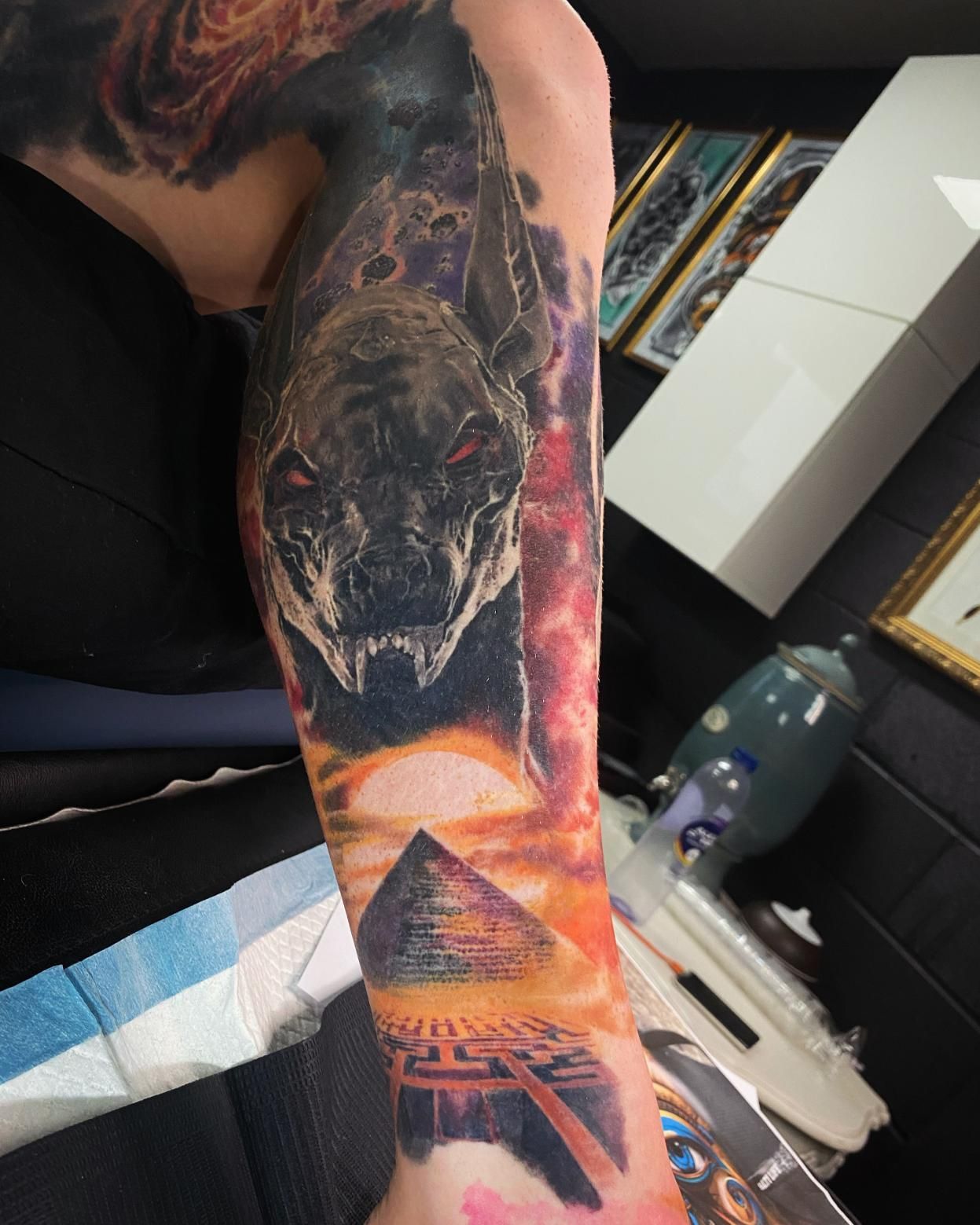 A Person Has a Tattoo of a Snake and a Pyramid on Their Arm  — Gallery Tattoo in Medowie, NSW
