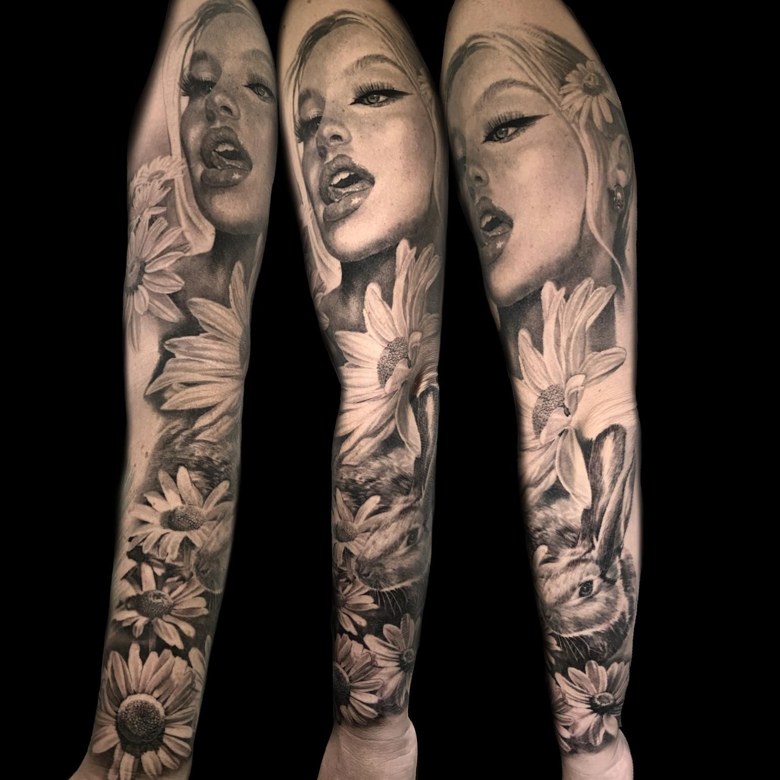 A Black and White Tattoo of a Woman 's Face and Flowers on a Full Sleeve — Gallery Tattoo in Medowie, NSW