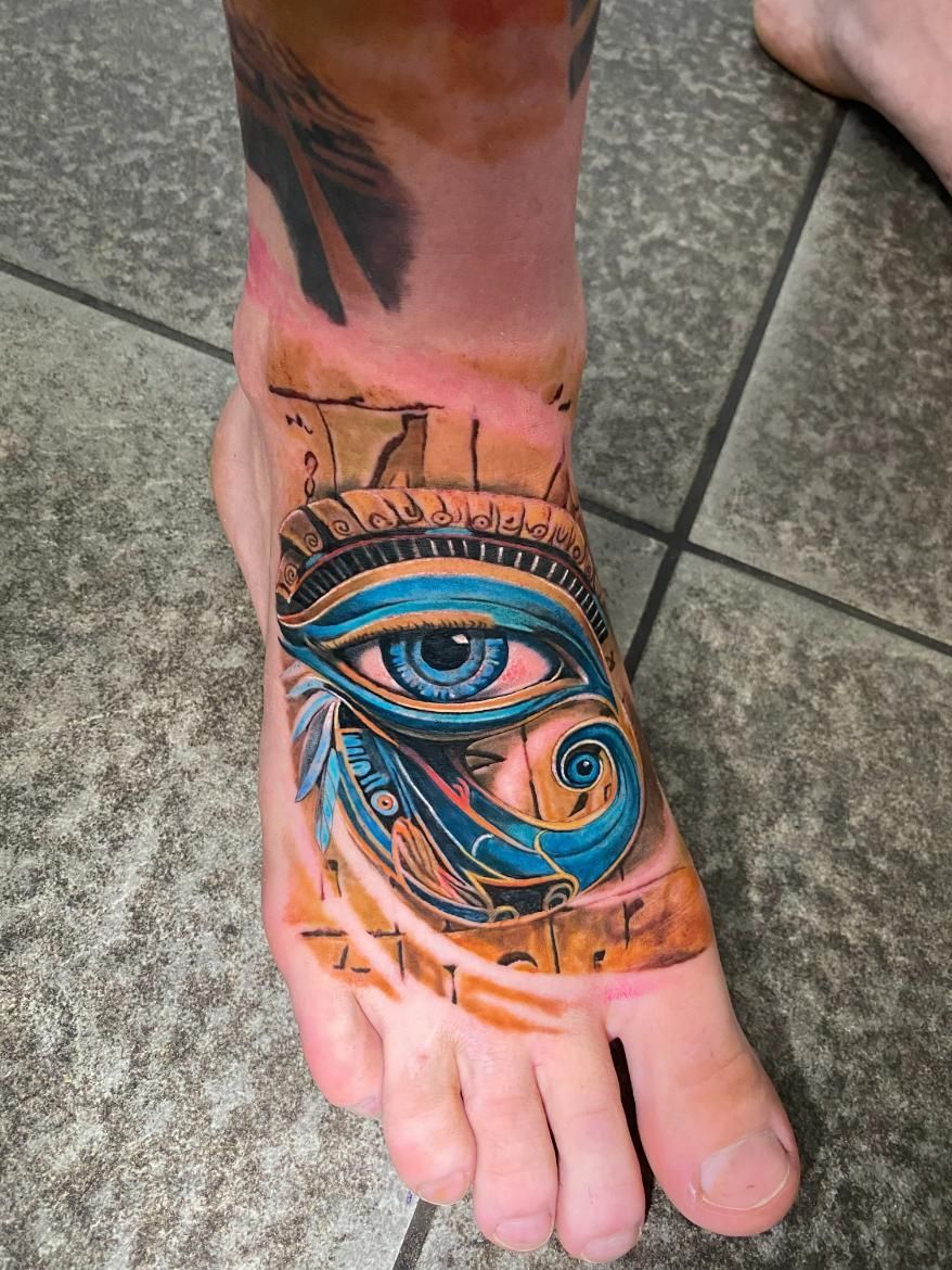 A Person Has a Tattoo of an Eye on Their Foot — Gallery Tattoo in Medowie, NSW