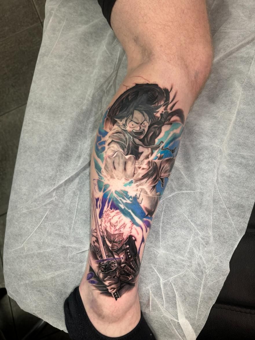 A Person is Getting a Tattoo on Their Leg — Gallery Tattoo in Medowie, NSW